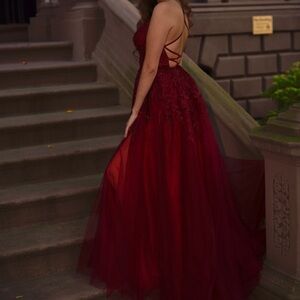 Color is maroon. Worn once for professional pictures. Size is a S but runs big.